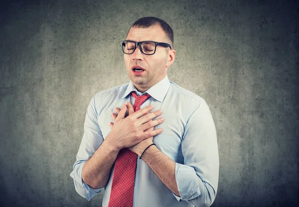 Young man having asthma attack or chest pain — Stock Photo, Image