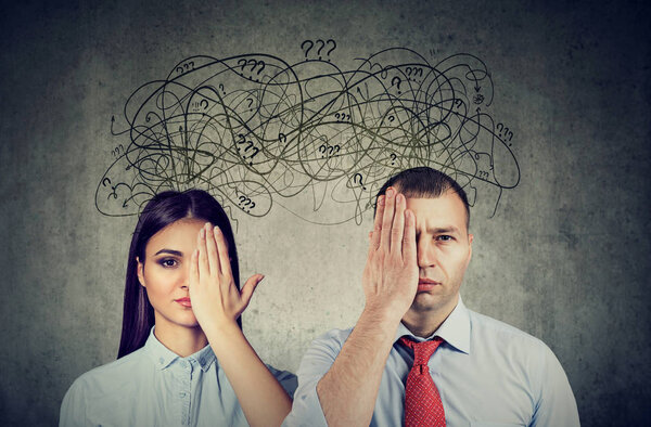 Half blindfolded couple having communication problems and share anxious thoughts 
