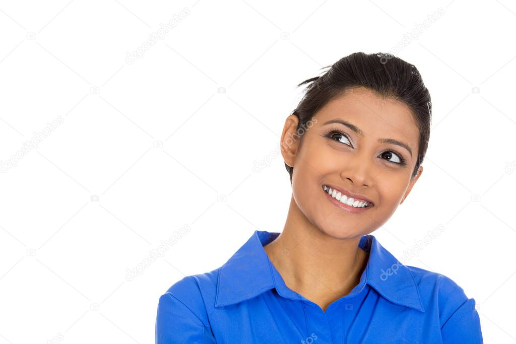 Portrait of a smiling young woman, student thinking looking up having an idea