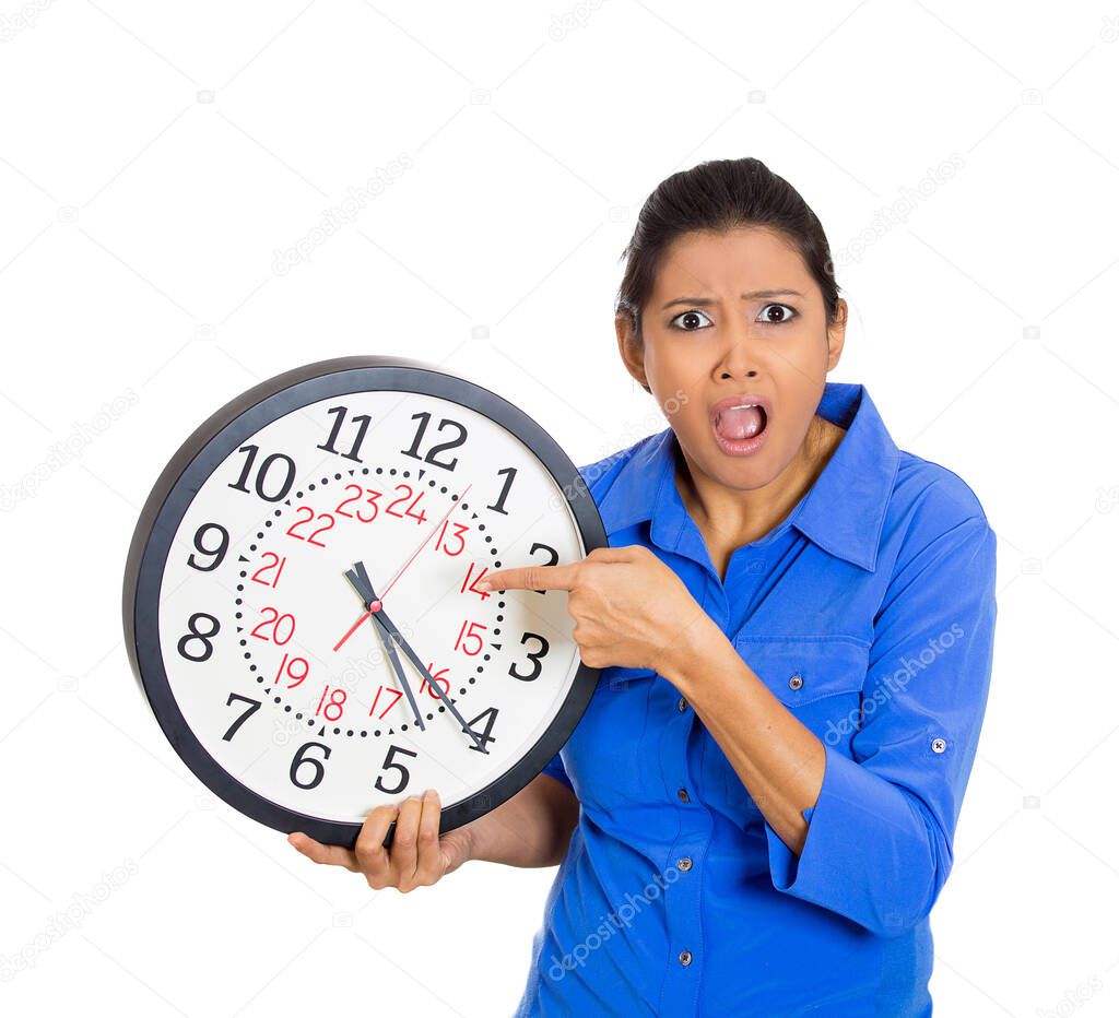 Portrait of a businesswoman, holding a clock feeling very stressed, pressured by lack of and running out of time 