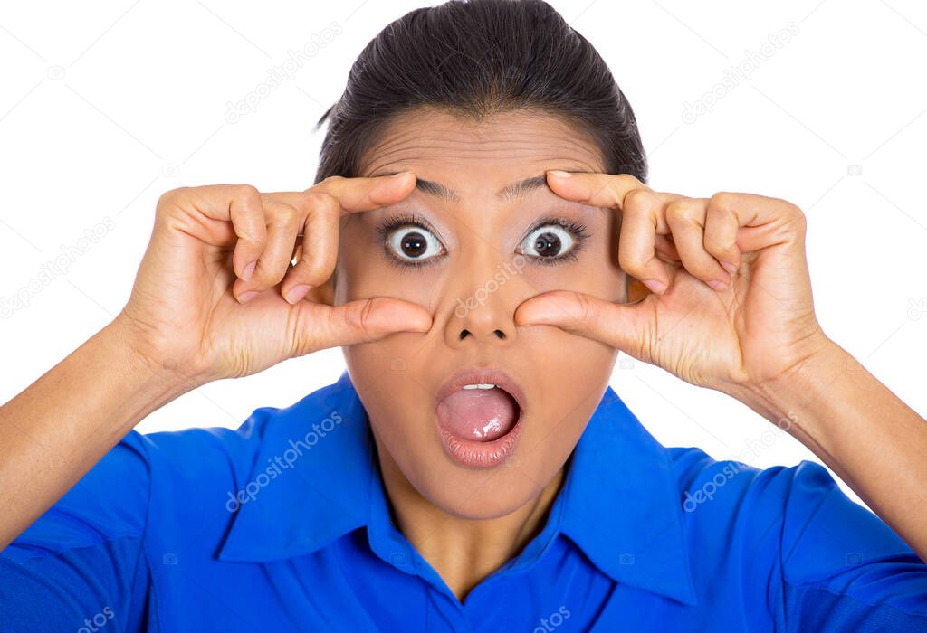 Closeup of a shocked looking young woman isolated on white background 
