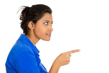 Side profile portrait of young unhappy, serious woman pointing at someone finger isolated on white background  clipart