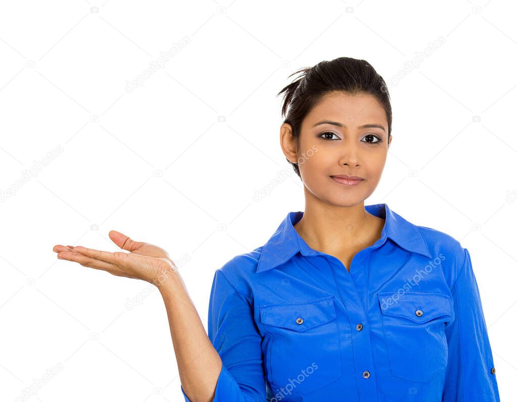 Portrait of happy young smiling woman gesturing pointing to space at left isolated on white background.
