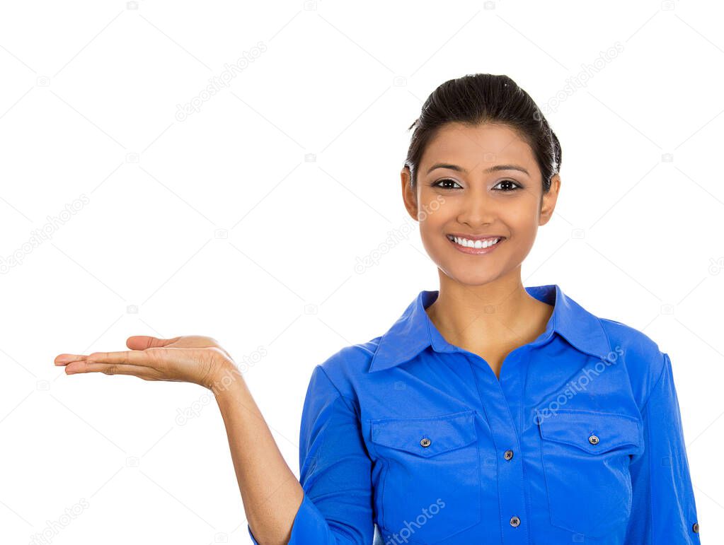 Portrait of happy young smiling woman gesturing pointing to space at left isolated on white background.