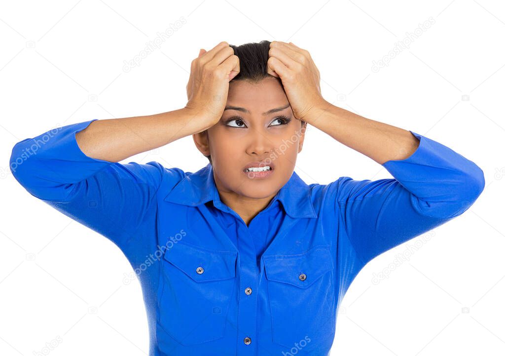 Closeup portrait of young stressed woman having headache pain, feeling overwhelmed, isolated on white background.