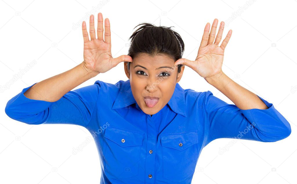 Portrait of a funny angry young childish rude bully woman sticking tongue out at you camera gesture, isolated on white background