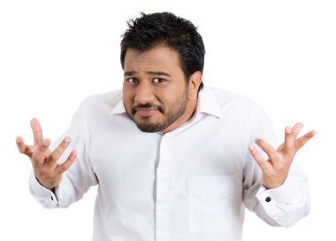 Closeup portrait of angry unhappy young man arms out asking what's the problem who cares so what, I don't know. Isolated on white background. Negative human emotion facial expression feeling clipart