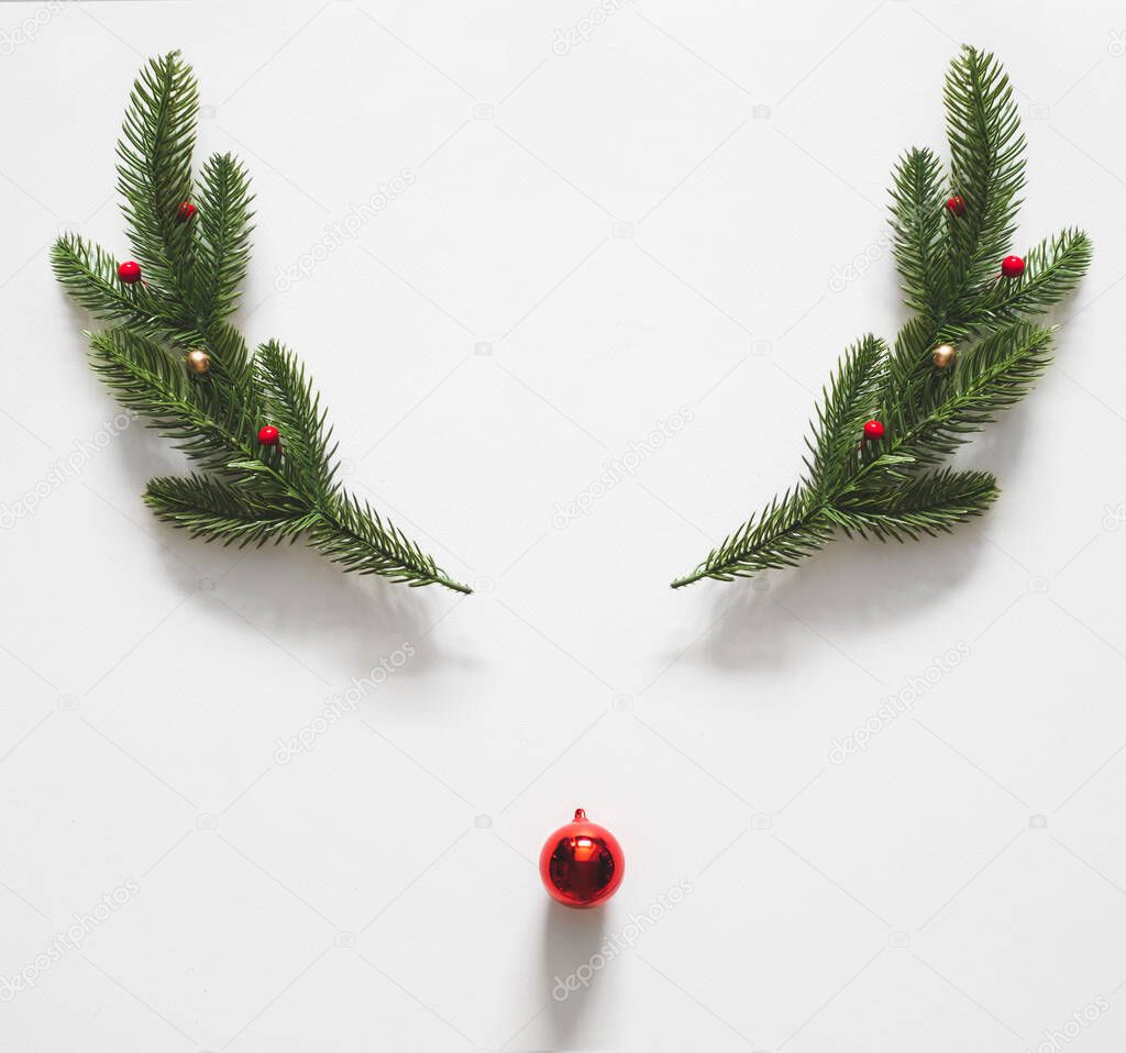 Reindeer made of christmas decoration over white background for christmas concept. flatlay