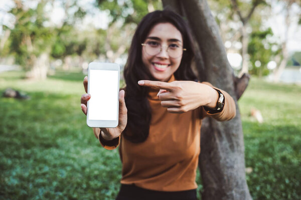 Hands holding / using smartphone / cell phone with isolate screen for internet online shopping and e-commerce transfer money concept
