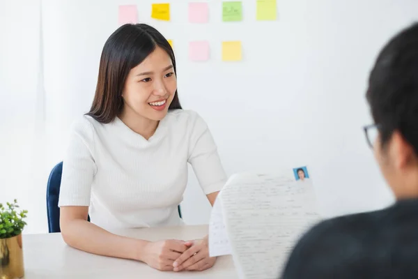 Asian business woman discussing/job interview with colleauge/boss for business meeting