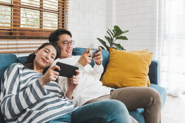 Asian couple man and woman talking working  spend time together at home, Asian couple family lifestyle concept