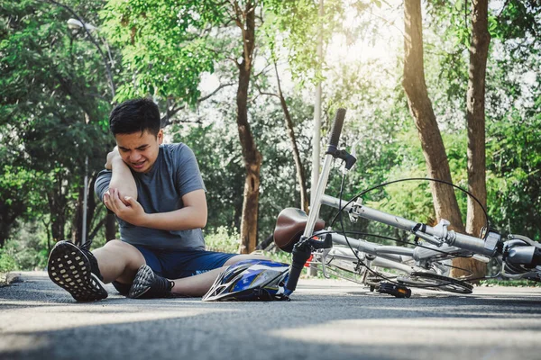 Boy injury hurts from falling bike, hurt on his arms, pain ache from workout concept