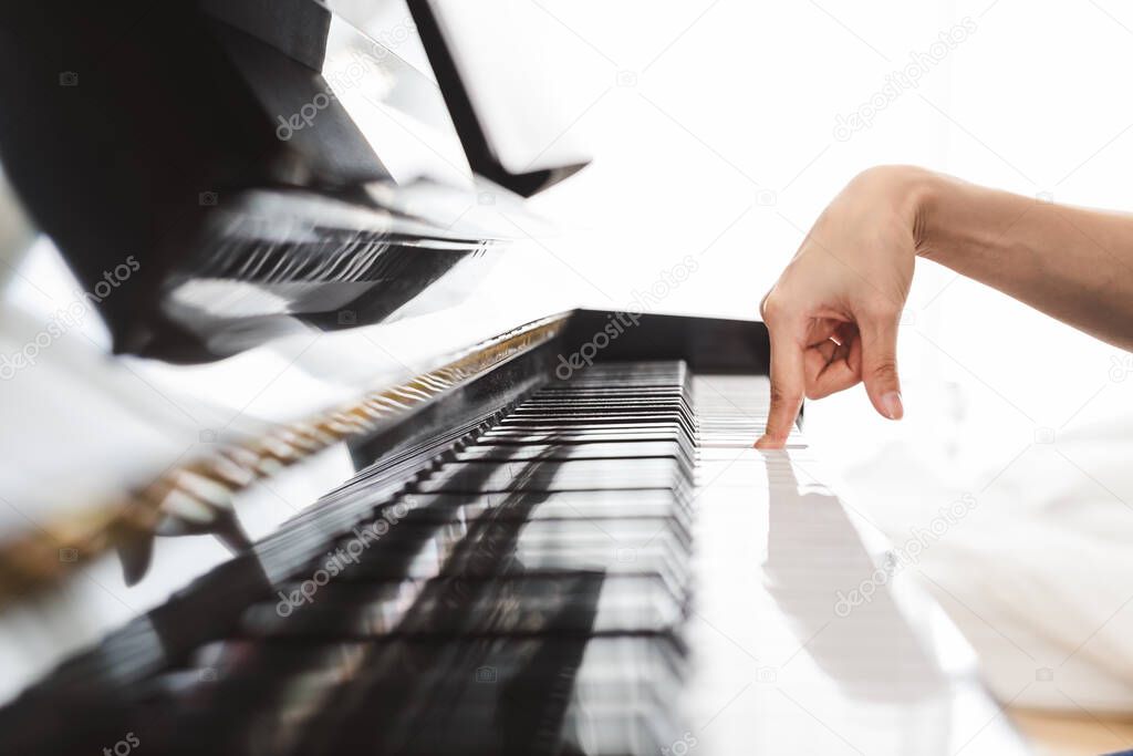 Classic piano key with musician hands playing