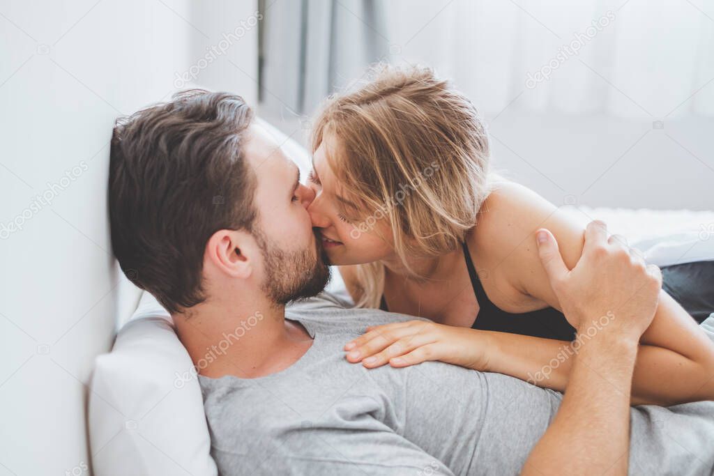 Happy couple lover on bed, hug and kiss in romantic time, love and passionate concept.