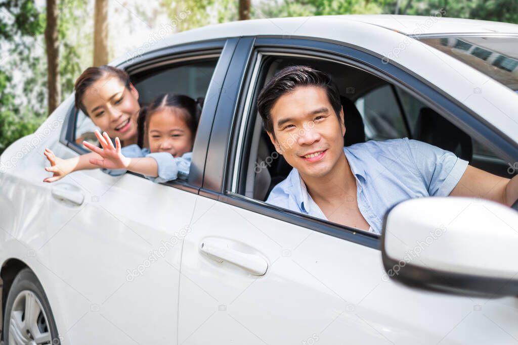 Happy enjoy Asian family in car driving to travel in weekend