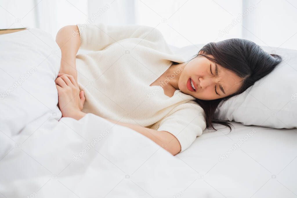 Asian woman stomachache, feel pain for period concept