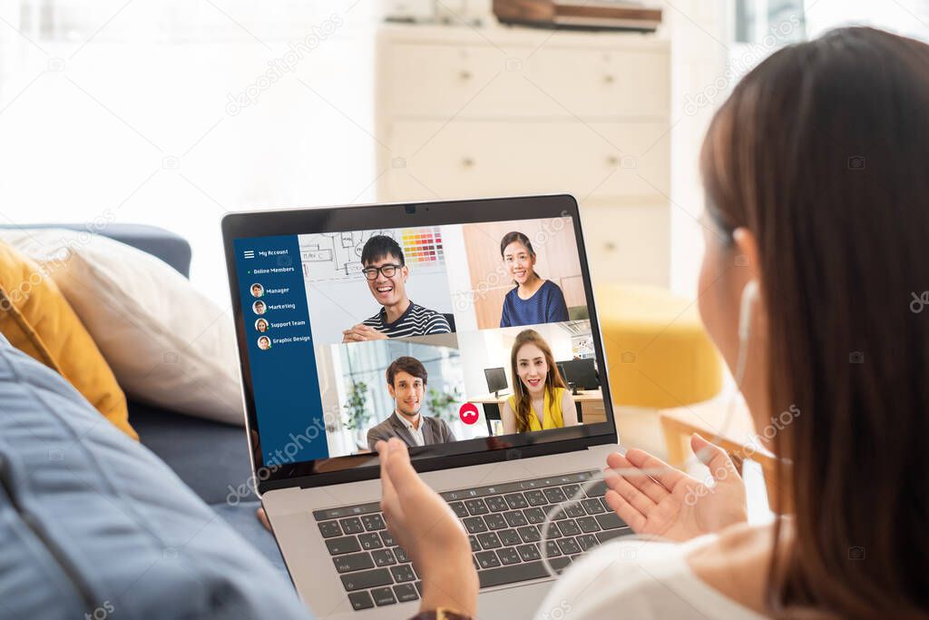 Young Asian businesswoman work at home and virtual video conference meeting with colleagues business people, online working, video call due to social distancing