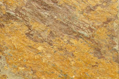bir arka plan veya duvar kağıdı olarak kullanılmak üzere taştan yapılmış turuncu ve kahverengi dokulu arka plan