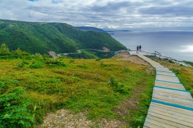 Chticamp, Canada - September 19, 2018: Views of the skyline trail, with tourists, in Cape Breton Highlands National Park, Nova Scotia, Canada clipart
