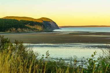 Sunset view of coastal landscape in Fundy National Park, New Brunswick, Canada clipart