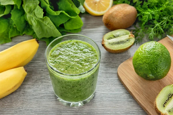 Healthy green smoothie made from fruits, vegetables and greens.