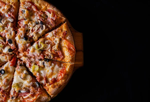 Pizza achtergrond zwart Stockfoto