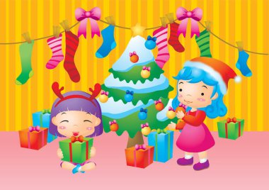Noel ağacı süsleyen kızlar
