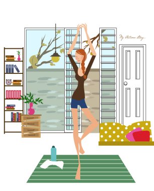 Yoga yapan kadın evin zemininde poz veriyor.