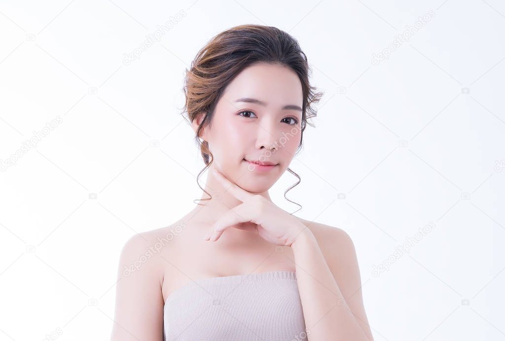 Portrait of beautiful Asian girl with clean and fresh skin on white background. Skincare and Cosmetology concept.