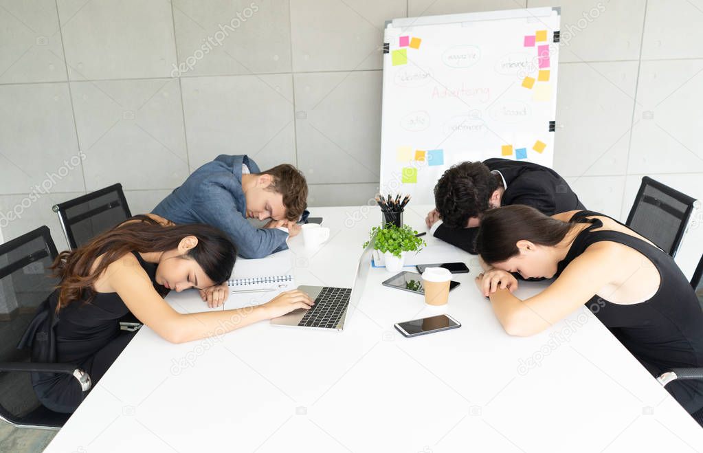Group of business people exhausted sleep in a meeting.Concept of