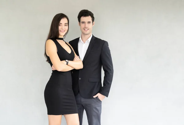 Young  smiling business woman and business man while standing in — Stock Photo, Image