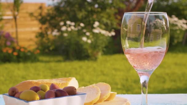 Rose wine, bread and olives — Stock Video
