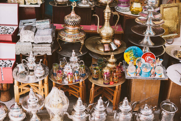 Tunisia, Tunisia - June 1, 2020. The eastern market in the medina of Tunisia with beautiful colored dishes, teapots and souvenirs.