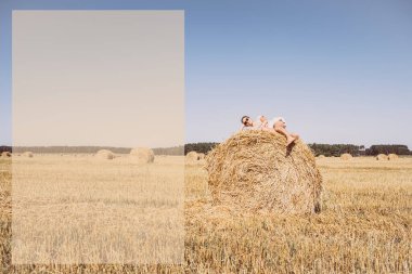 Yalan söyleyen ve samanlıkta dinlenen bir kız. Hasat, açık hava serinliği, mavi gökyüzü. Uzayı kopyala Yaz listesi yapmak için.