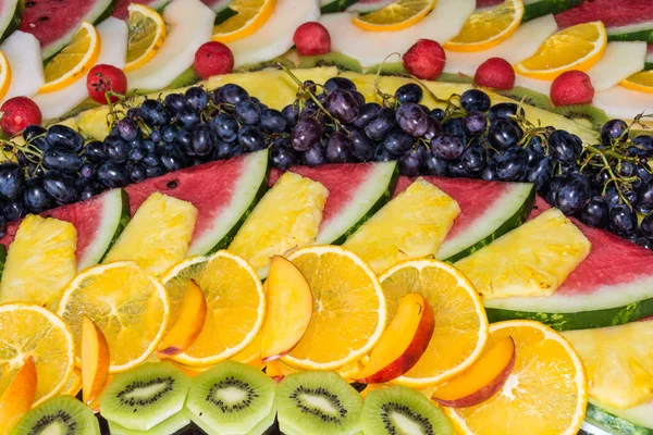 compositions or architecture of fresh fruit cut for buffets. typical summer fruits of Sicily, refreshing and healthy.