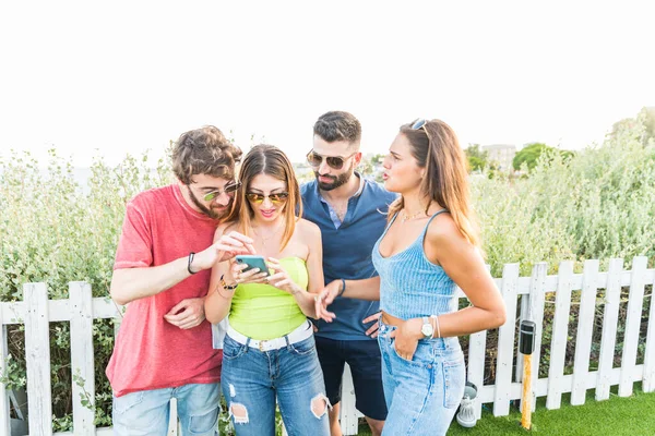 friends group using smartphone - People hands addicted by mobile smart phone - Technology concept with connected trendy millennials - Young millenial people sharing content on social media networks
