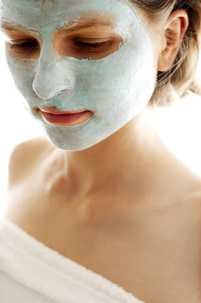 Close Woman Towel Blue Facial Mask Her Face — Stok fotoğraf