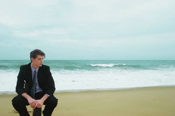 Guy Business Suit Sitting His Briefcase Beach — Stock Photo, Image