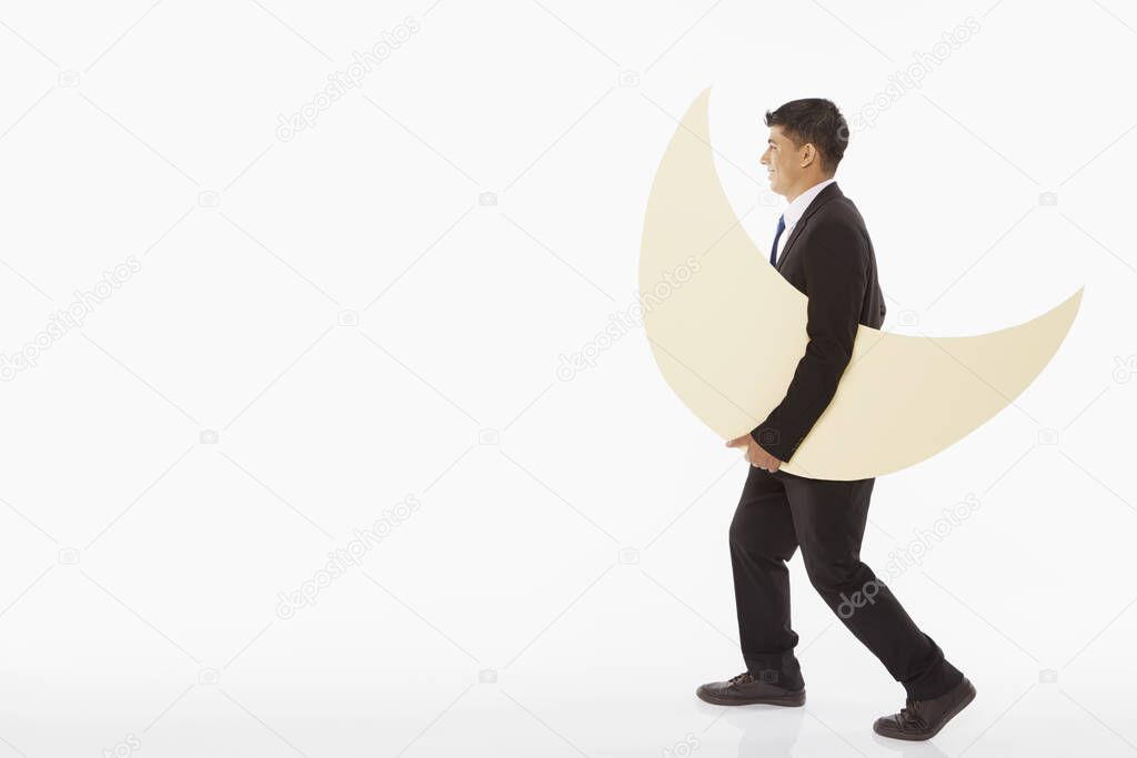Businessman carrying a crescent moon