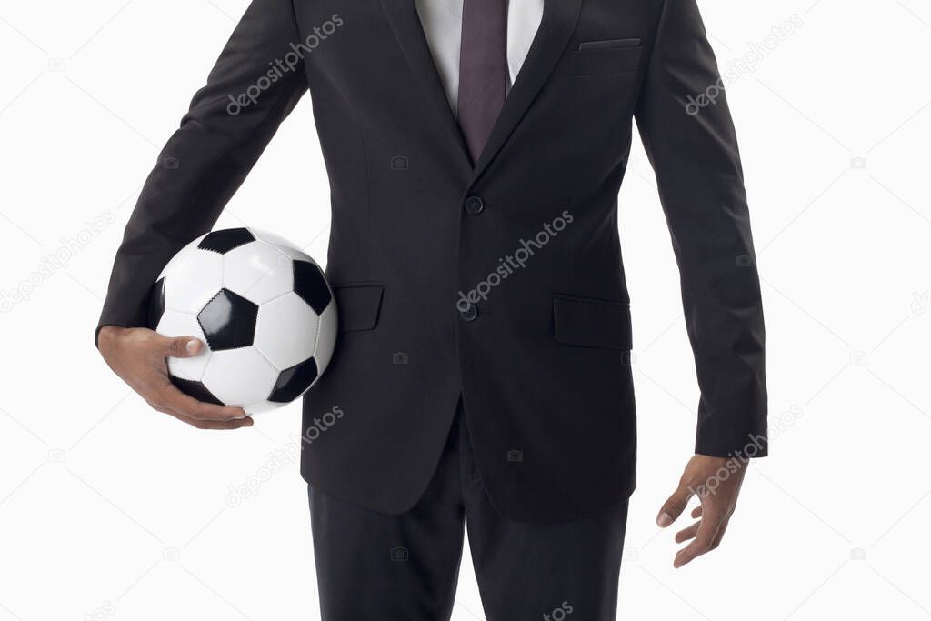 Soccer manager holding a ball