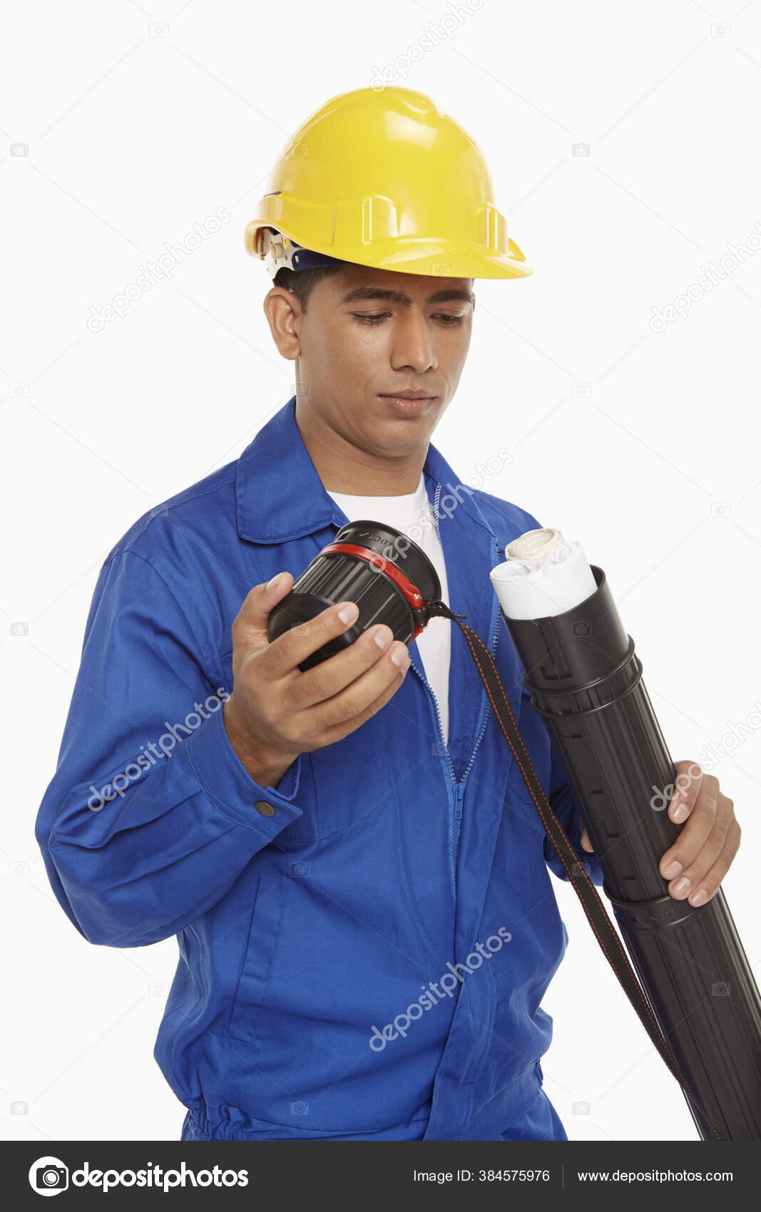 Construction Worker Taking Out Blueprint Tube Stock Photo by