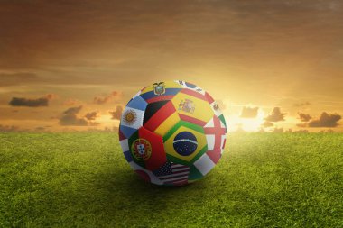 Dünya futbol topunu oyun sahasında bayraklar