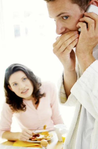 Man Whispering Hand Phone His Wife Watching Suspiciously — Stock Photo, Image