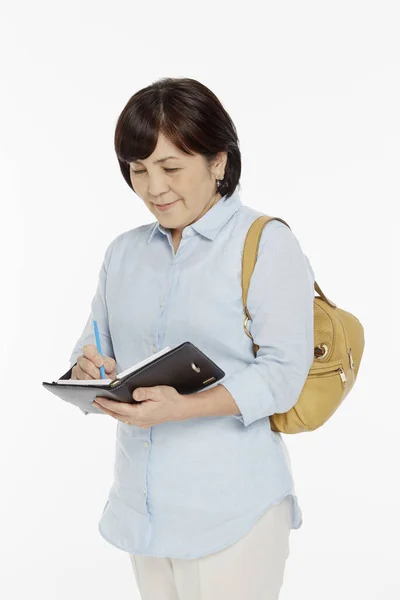 Mujer Escribiendo Notas Cuaderno —  Fotos de Stock