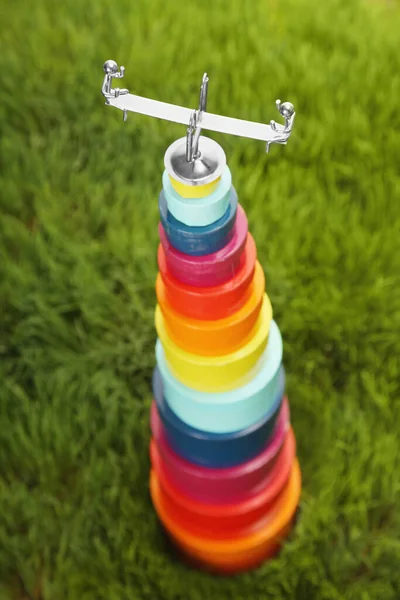 Toy teeter-totter on top of stacked boxes