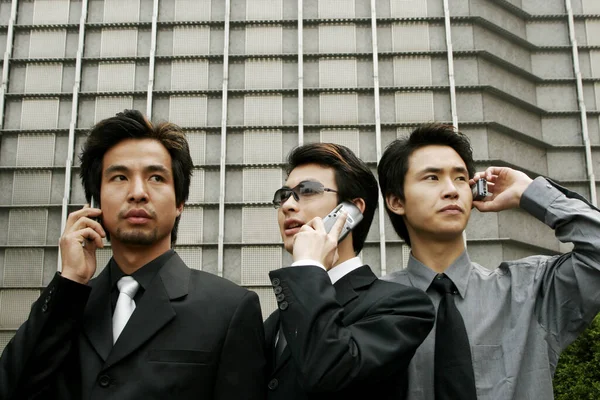 Three Businessmen Talking Hand Phones — Stock Photo, Image