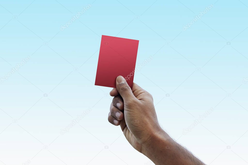 Soccer referee giving red card