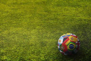 Dünya futbol topunu oyun sahasında bayraklar