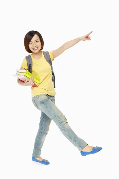 Mujer Sonriendo Señalando Izquierda —  Fotos de Stock