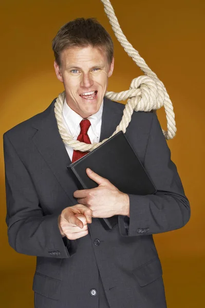 Businessman Pointing Camera While Rope Hanging His Neck — Stock Photo, Image